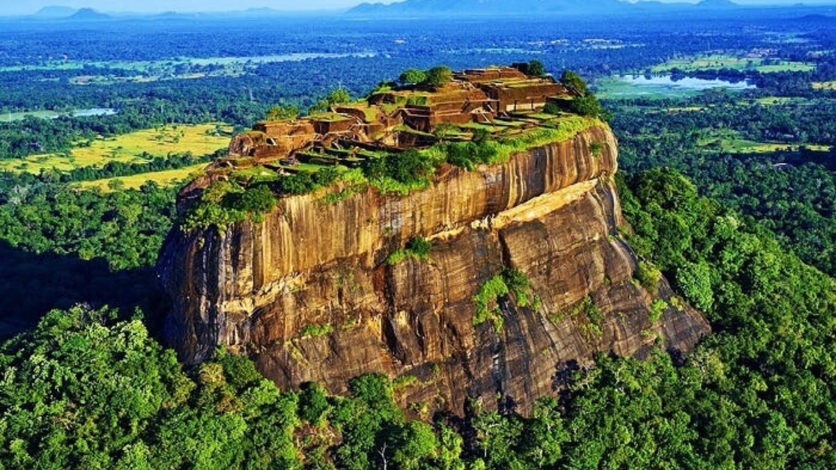 Ancient Sigiriya Rock Fortress in Sri Lanka surrounded by lush green landscapes